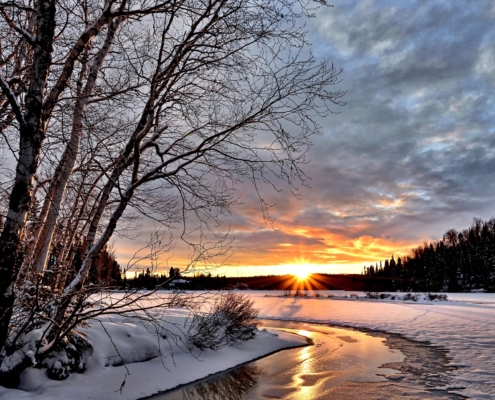 Photo of a snowy winter sunset.